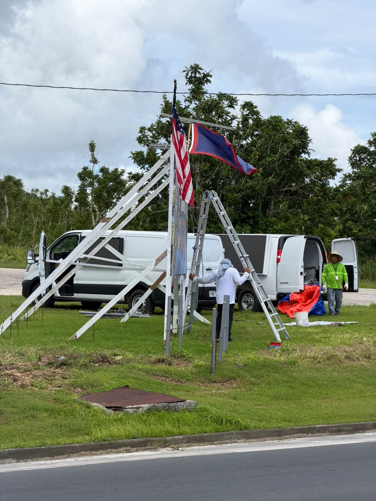 STORM PREP: The Office of Attorney General takes down billboards in preparation of TS Champi, Oct. 15