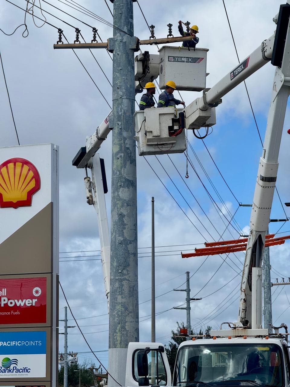 WORK: Guam Power Authority crews repairs storm-related damage to power lines.