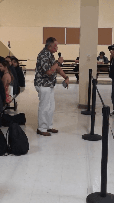 CALL: Guam Education Board member Angel Sablan calls for Superintendent Judith Won Pat to resign during the community meeting at Okkodo High School regarding double sessions between four school populations on Monday.
